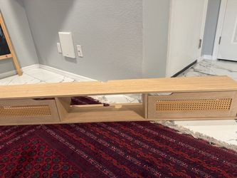 TV stand or wall mount that is stuck to the wall