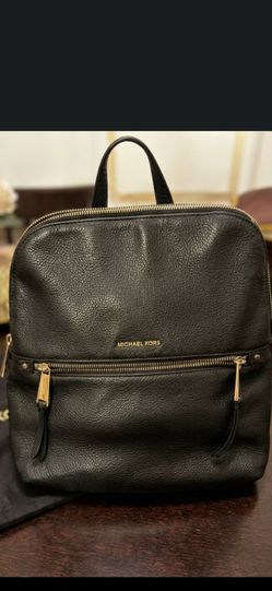• Brand: Michael Kors • Model: Quilted Backpack (See image_25.png) • Color/Material: Black quilted leather, gold-tone hardware. • Co