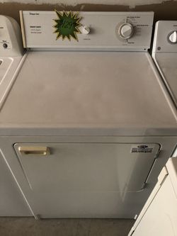 A white front load Magic chef dryer