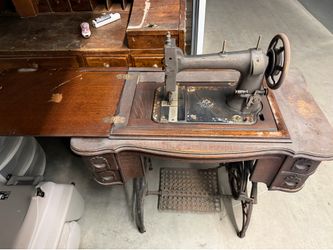 Antique sewing machine and cabinet