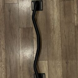 Black curved pull up bar.