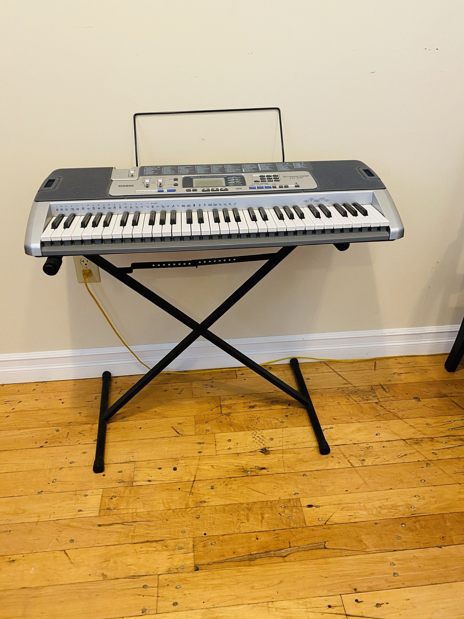 Casio LK-100 Keyboard. Vintage Antique. Key lighting system. 100 song bank. Never used. Like new condition. Excellent tool to help learning how to pla