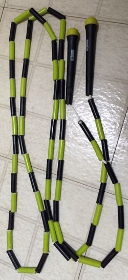 green and black skipping rope