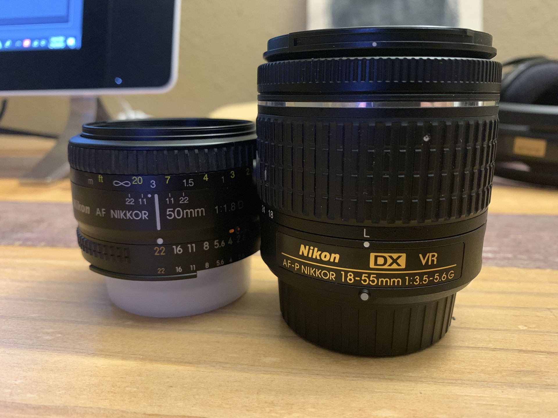 Two Nikon manual focus lenses. 50 mm & 18-55 mm