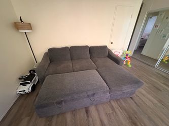 L shaped sectional with storage and bed
