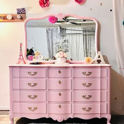 Beautiful french provincial dresser with mirror pink color with gold handles 
