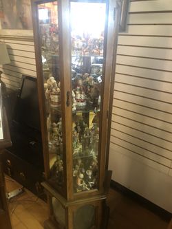 Curio cabinet with lights and glass shelves