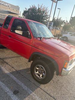 Red Nissan Pickup Truck Extended Cab