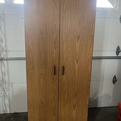 Storage cabinet 4 shelves and 2 doors. Height; 72” Wide : 30” Depth: 16”