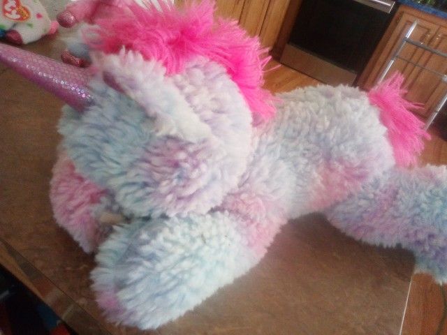 Plush Unicorns (one Is a toy unicorn).