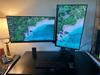 HP OMEN Gaming PC with monitors, mount, keyboard and mouse.