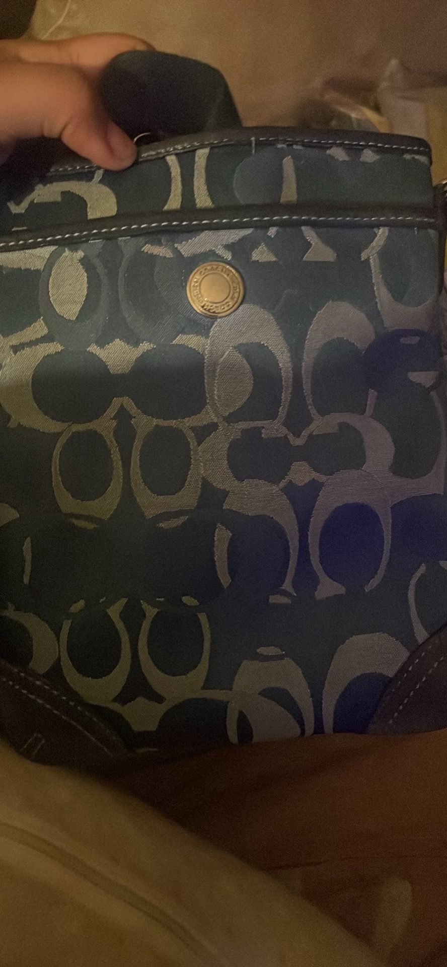 Coach crossbody bag with a blue and white signature canvas pattern