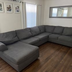 Large Gray U-Shaped Sectional Couch With Chaise