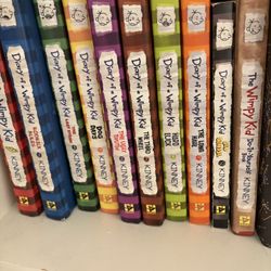 a collection of “Diary of the wimpy kid” hardcover books 
