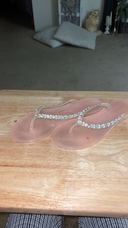Menghi crystal-embellished jelly flip-flops in a light pink