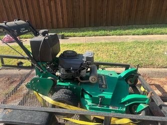 Green standing riding mower