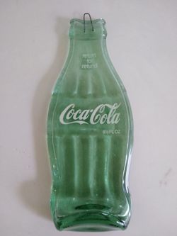 Coca-Cola flattened glass bottle hanging
