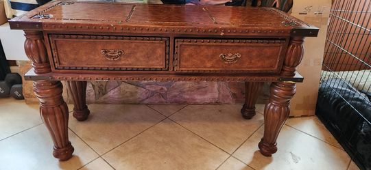 Old style ornate brown wood table