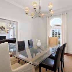 Glass top and wood base dinning table with 6 chairs