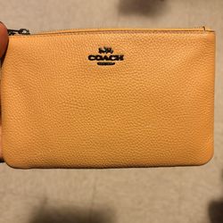 Yellow color  Wristlet (Original Coach). Just removed tags. Pure pebble leather
