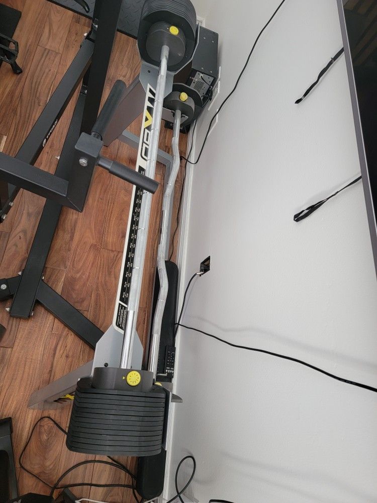 Curl Bar That Goes Up To 90 Pounds With V BAR AND RACK.