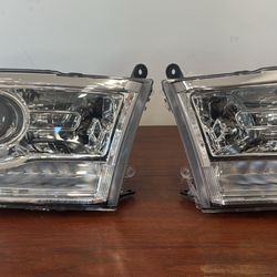 NEW NEVER USED RAM1500 LARAMIE HEADLIGHTS