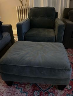 Gray Accent Chair with Matching Ottoman Price: $150 Description: Comfortable dark gray upholstered accent chair with matching oversized ottoman.