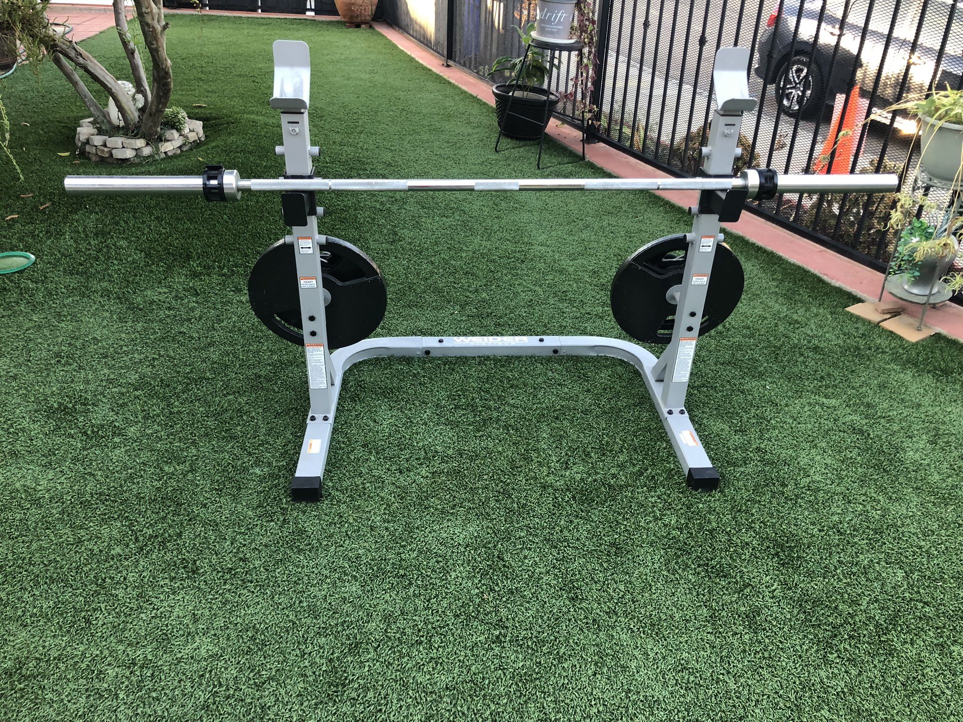Rack + Olympic Barbell + 290 lbs Weight Plates