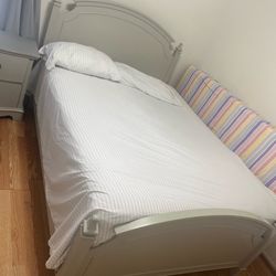 Double bed with mattress and nightstand