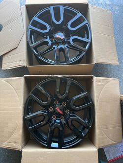 Two stock 2025 GMC Sierra 20” rims