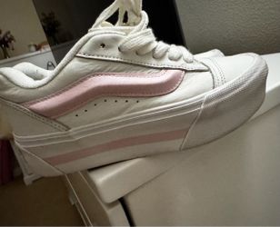 Pink and white platform vans
