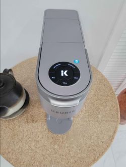The Keurig K-Iced (or K-Iced Plus) is a compact, gray single-serve pod coffee maker. Please read the complete description!