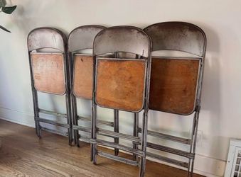 Set of 4 antique clarin folding chairs.