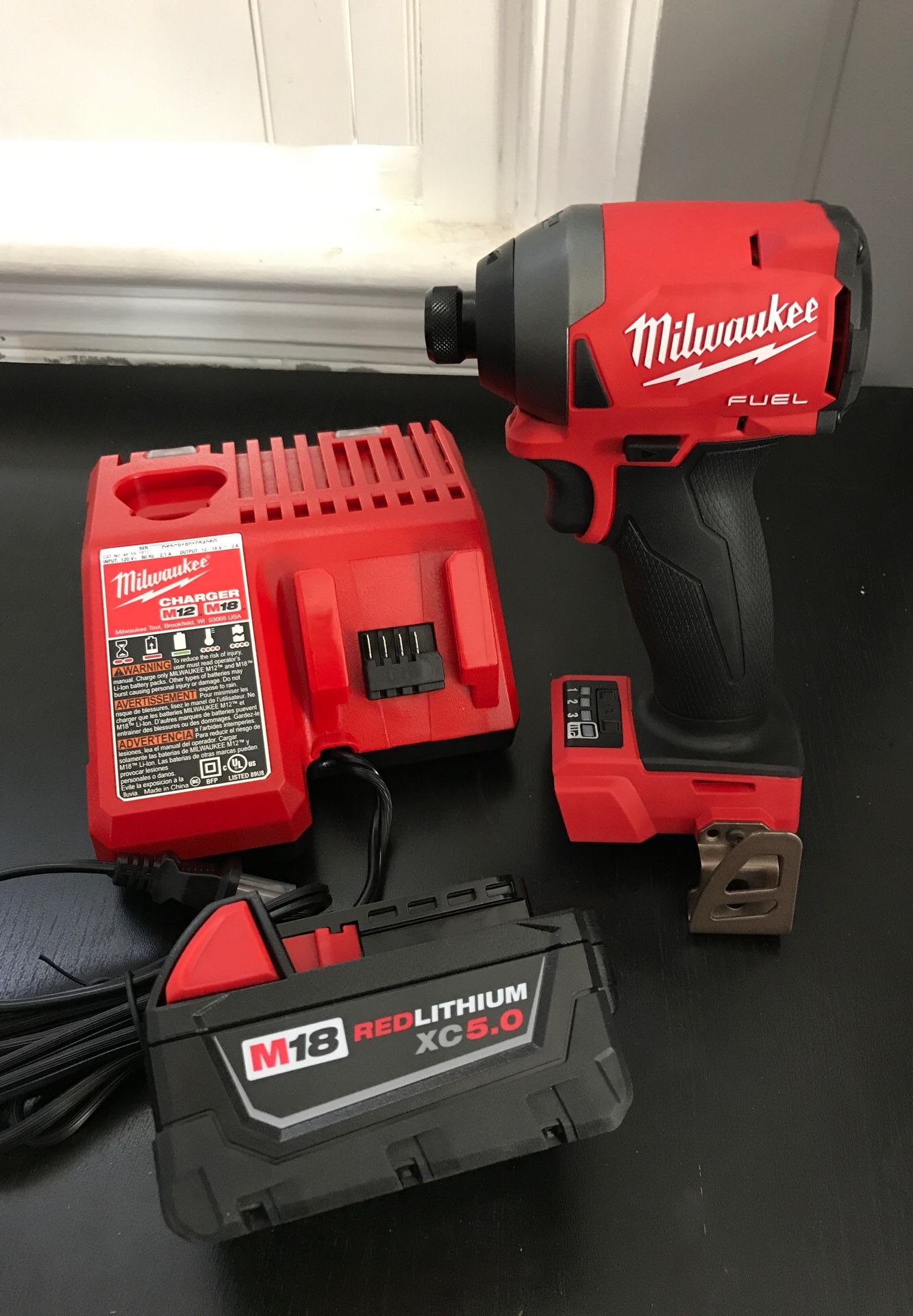 Milwaukee fuel impact kit with 5.0 battery