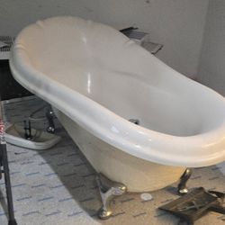 Fiberglass white tub with claw chrome feet