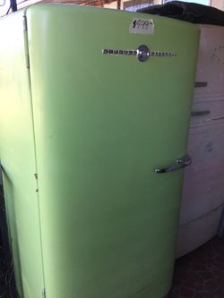 Antique General Electric refrigerator/ one year warranty