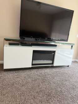 White TV stand with integrated electric fireplace