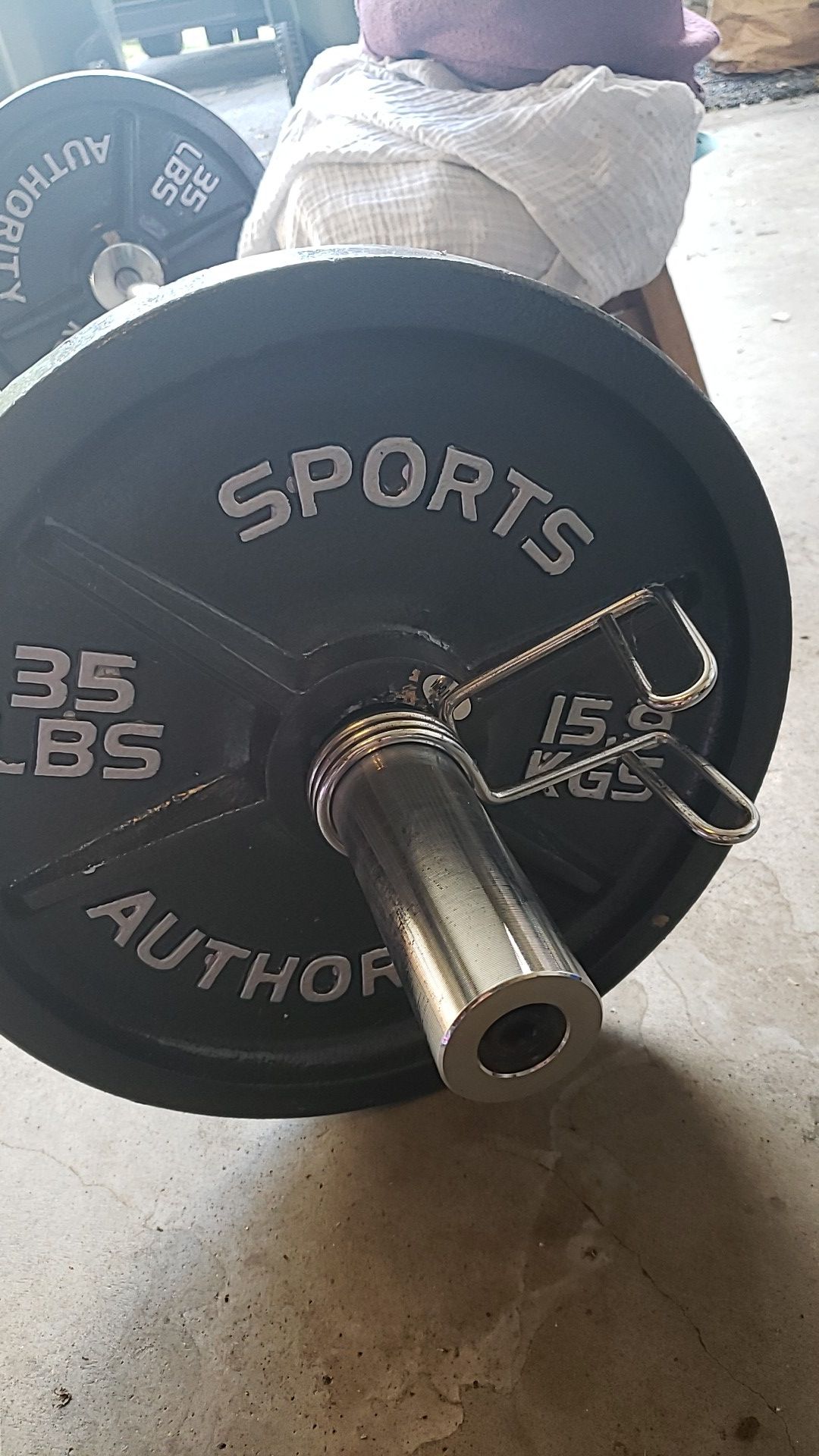 Olympic curl bar with (2) 35lb plates.