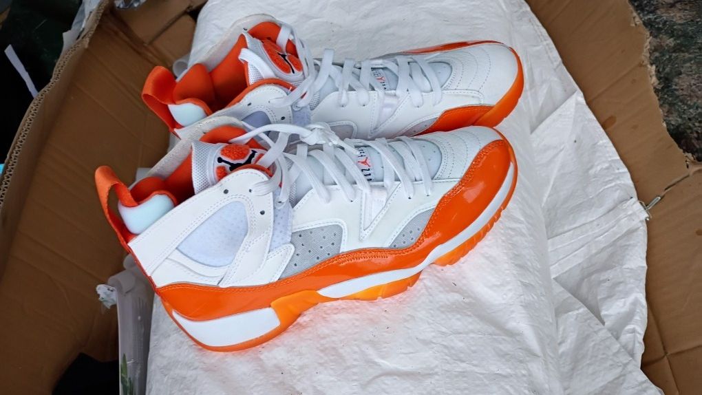 Nike Air Jordan Women's Jumpman Two Trey 'Starfish' sneaker in a white and orange