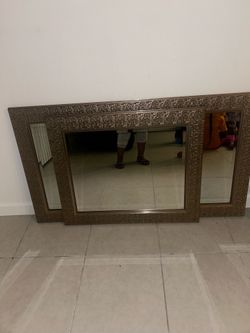 Two decorative gold mirrors, one large one small
