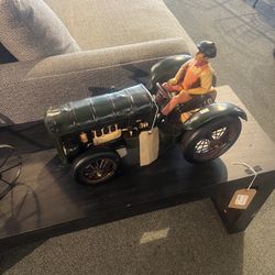 DECOR:  Man Riding a Dark Colored Tractor SKU LAV29L