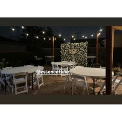 Tables, Chairs And Flower Wall 