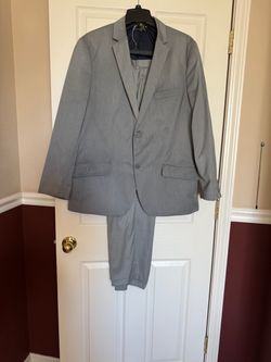 Light gray INC suit, size XL, pants size 36x30, in excellent condition.