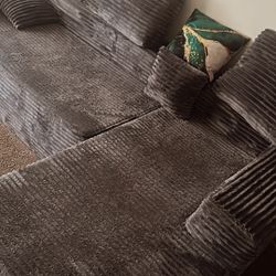 nice 2 piece gray sectional couch with pillows