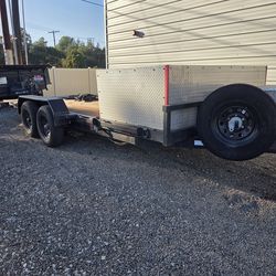 Tilt bed trailer. 20 feet of deck, front 4 feet fixed with storage box. Back 16 feet tilts. 2 years old. $7000.