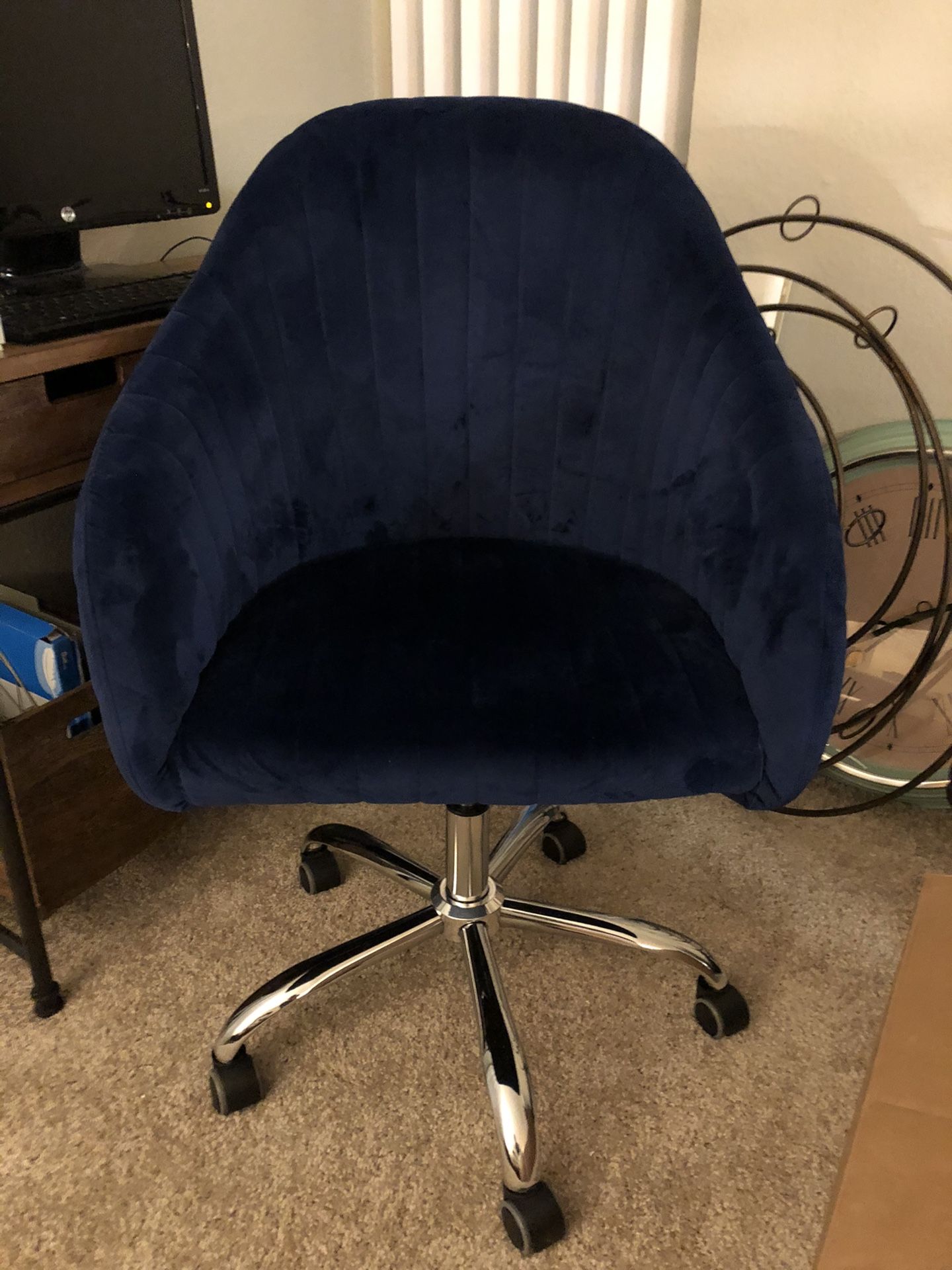 Navy blue velvet rolling chair