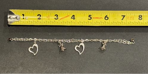 Sterling Silver charm bracelet (the tag & clasp have been removed & the class has been replaced with a magnetic clasp.) Double-link chain design. It h