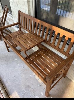 Outdoor bench with pull out table