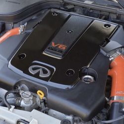 Who is missing Infiniti emblem on the engine cover?