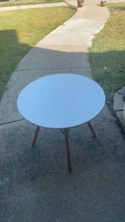 Used white circular table